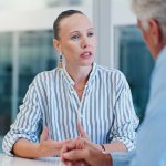Employee explaining a workplace complaint to a manager during an office meeting