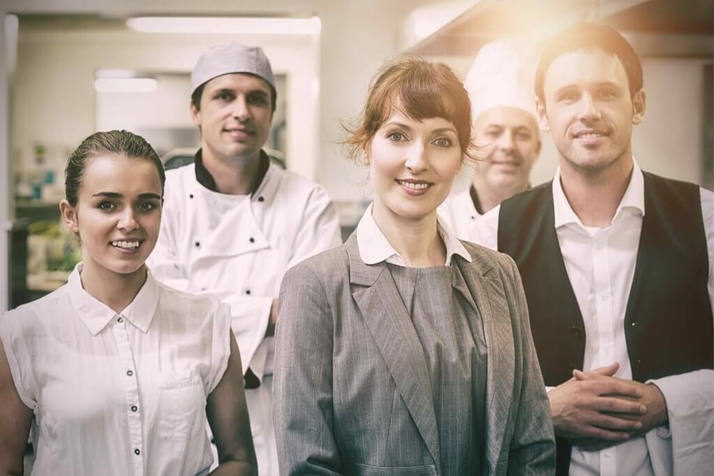 Restaurant staff working a shift in a commercial kitchen