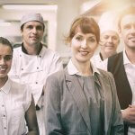 Restaurant staff working a shift in a commercial kitchen
