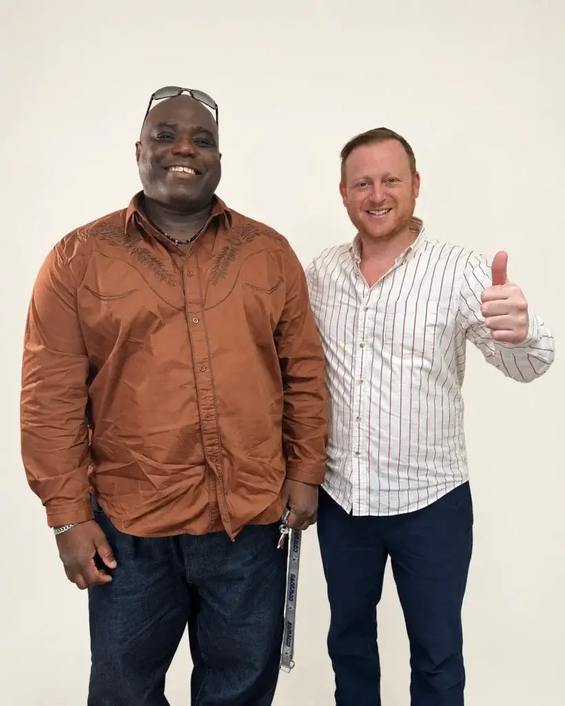 Zev Abramson giving a thumbs up with a client at Abramson Labor Group