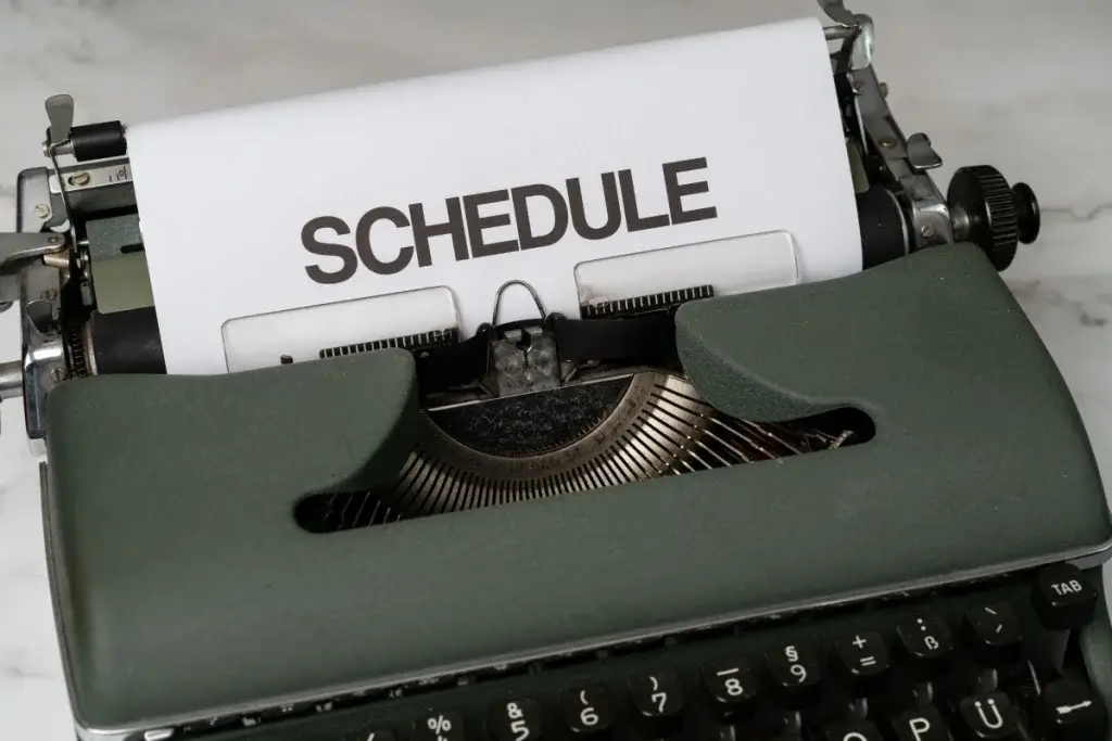 Typewriter with a page reading Schedule, representing changes to work hours in California