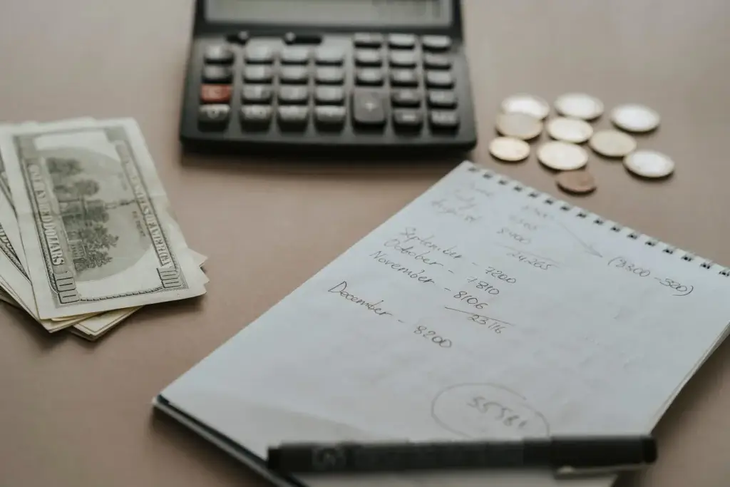 Calculator and coins for planning partial pay during paternity leave in California